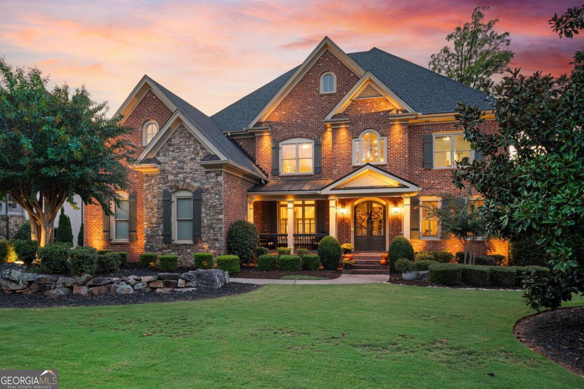 a front view of a house with a yard