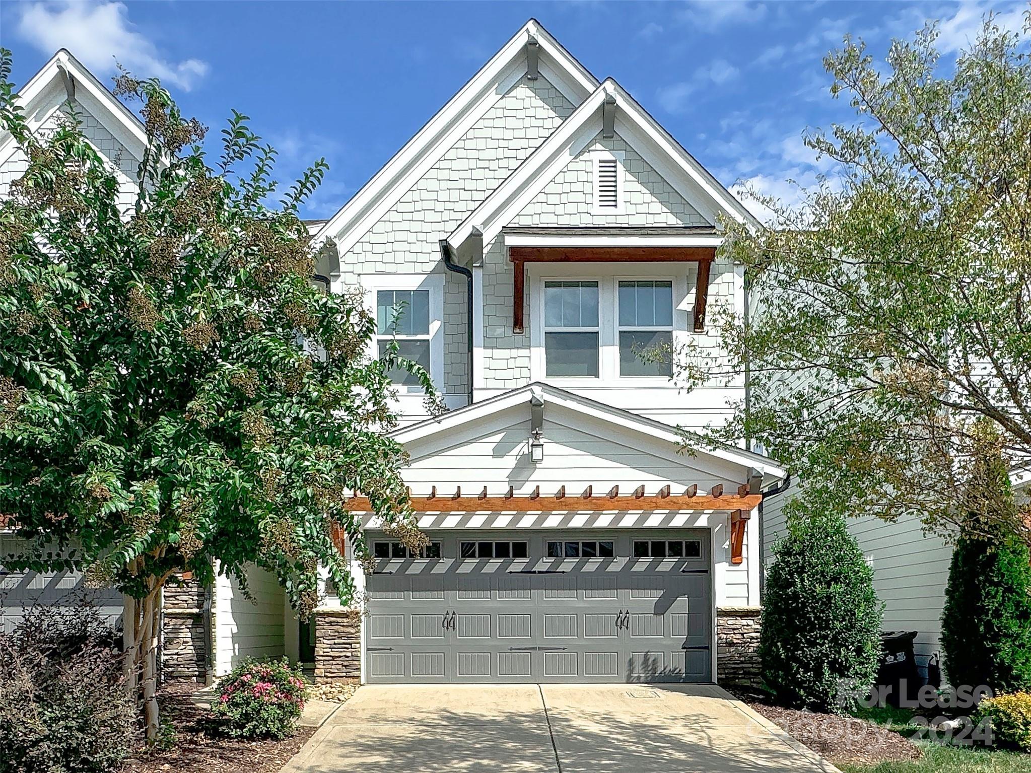 front view of a house with a garden