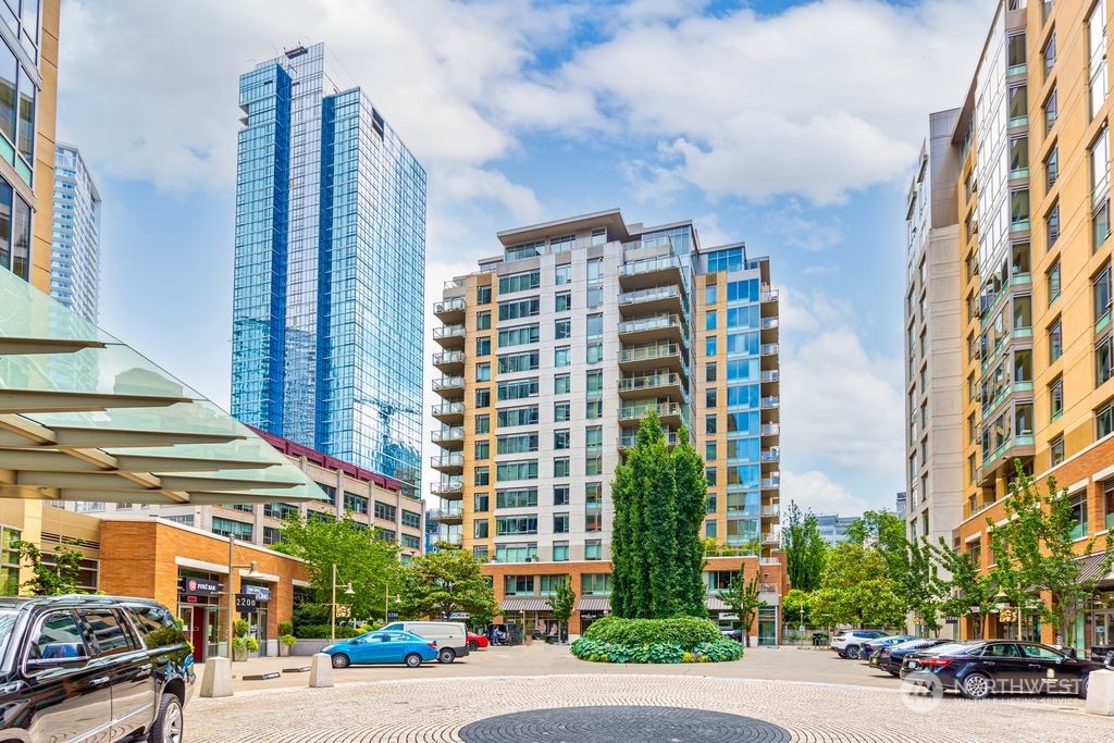 a city street lined with buildings and trees