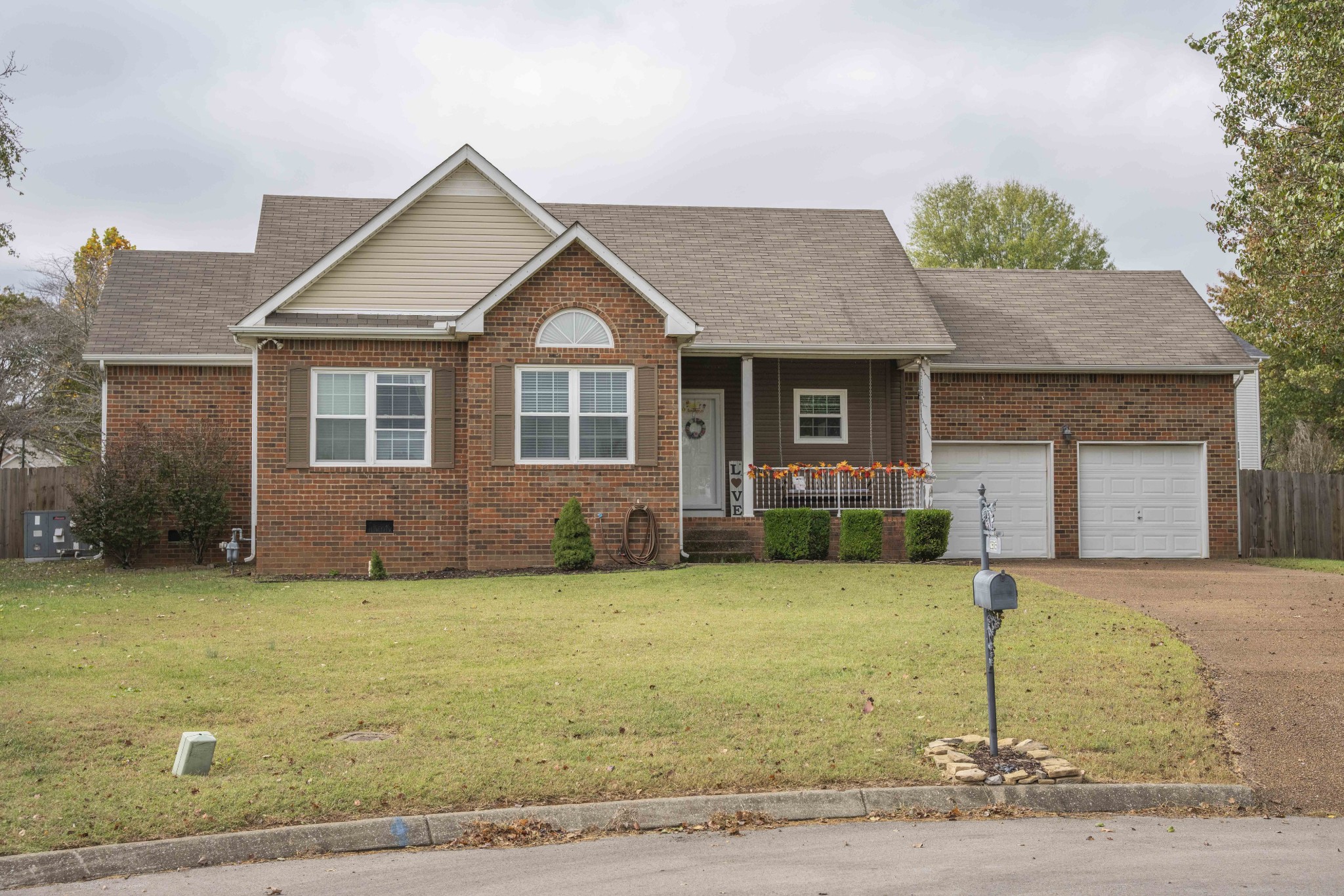 a front view of a house with yard