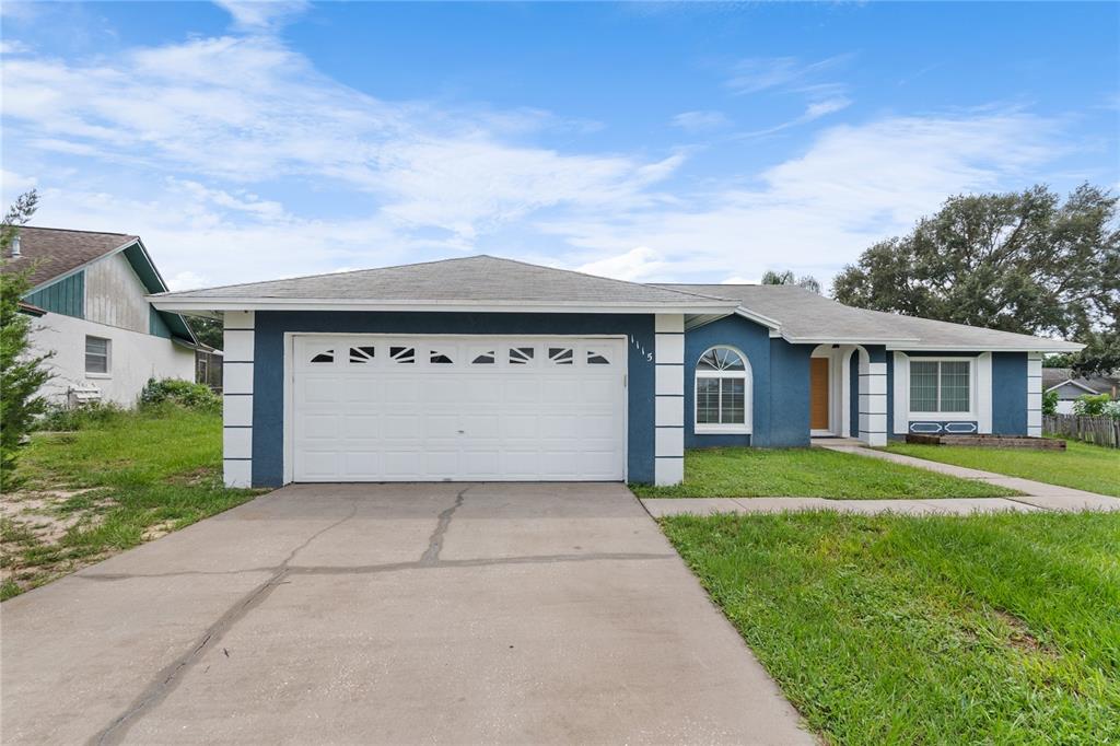 front view of a house with a yard