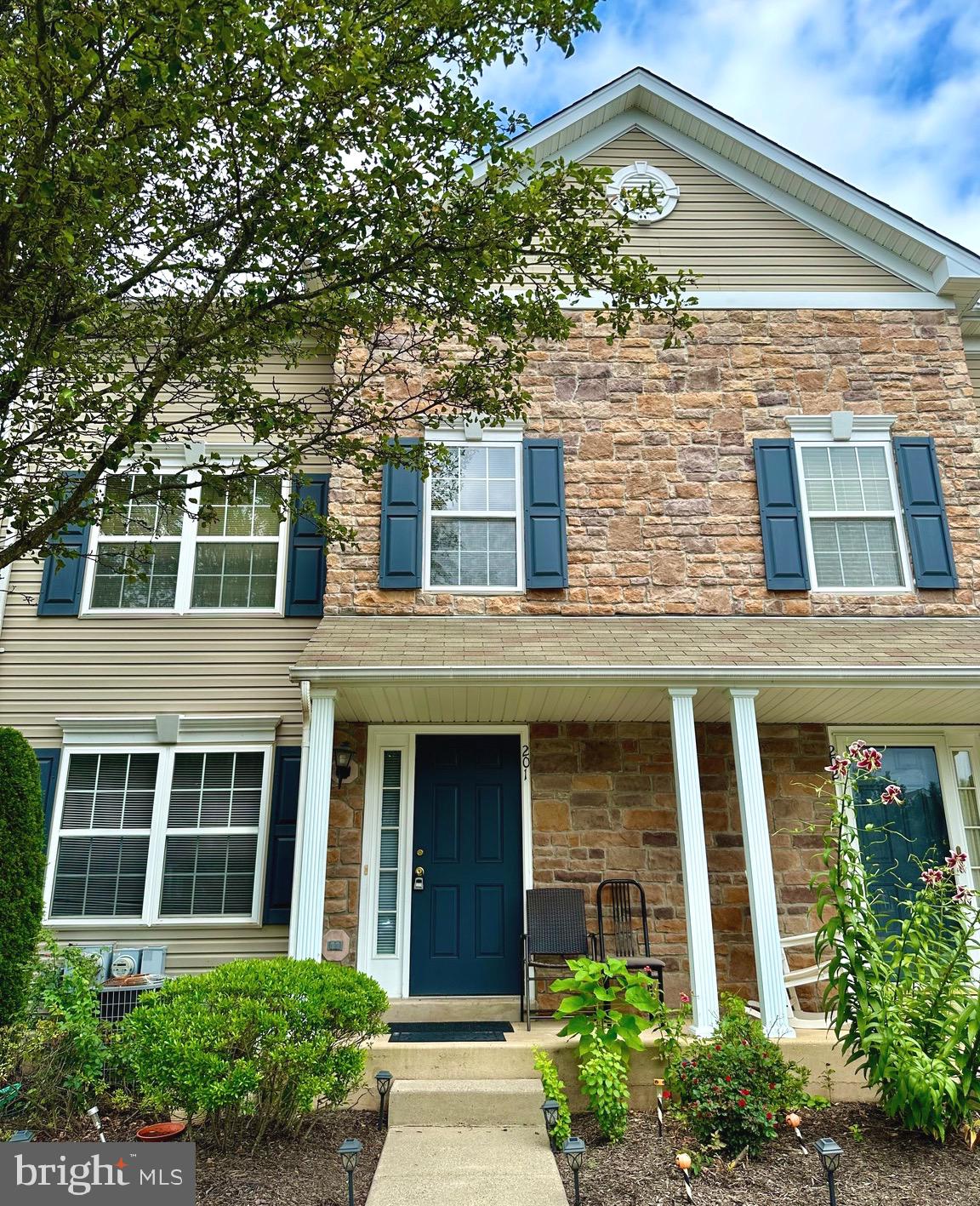 front view of a brick house with a large windows