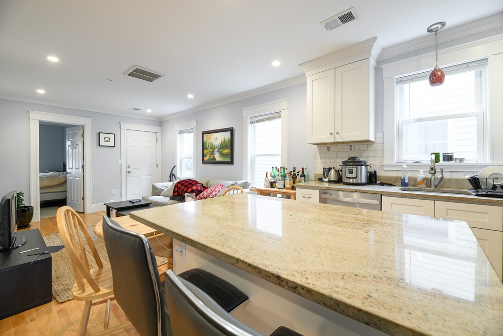 a large kitchen with granite countertop lots of counter top space