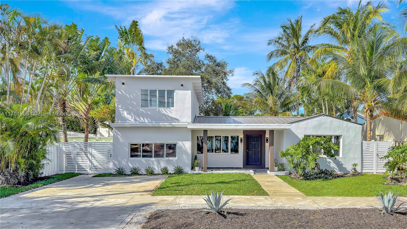 a view of house with outdoor space and garden