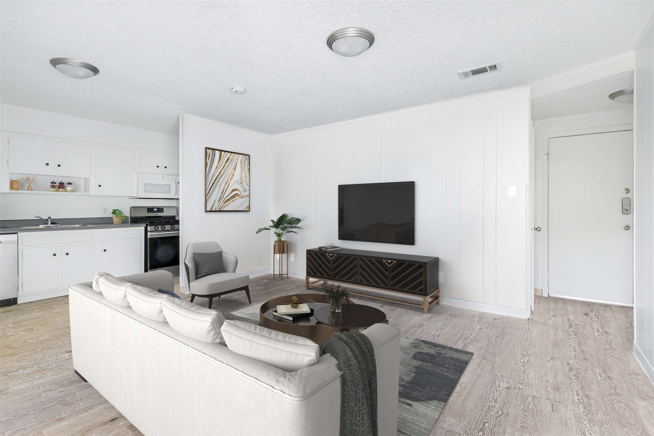 a living room with furniture and a flat screen tv