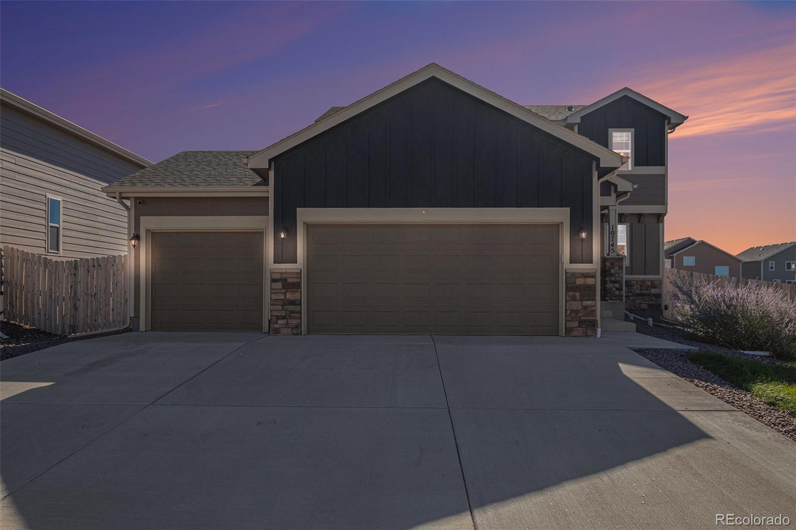 a front view of a house with a garage