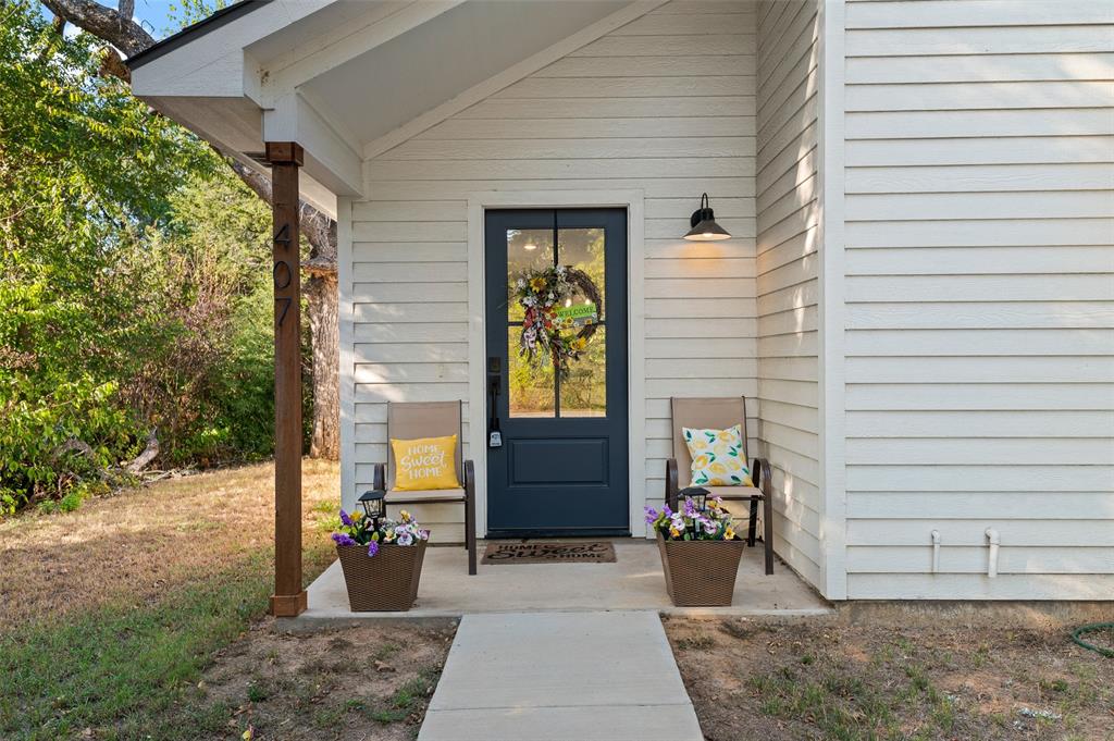 a view of a brick house with outdoor space