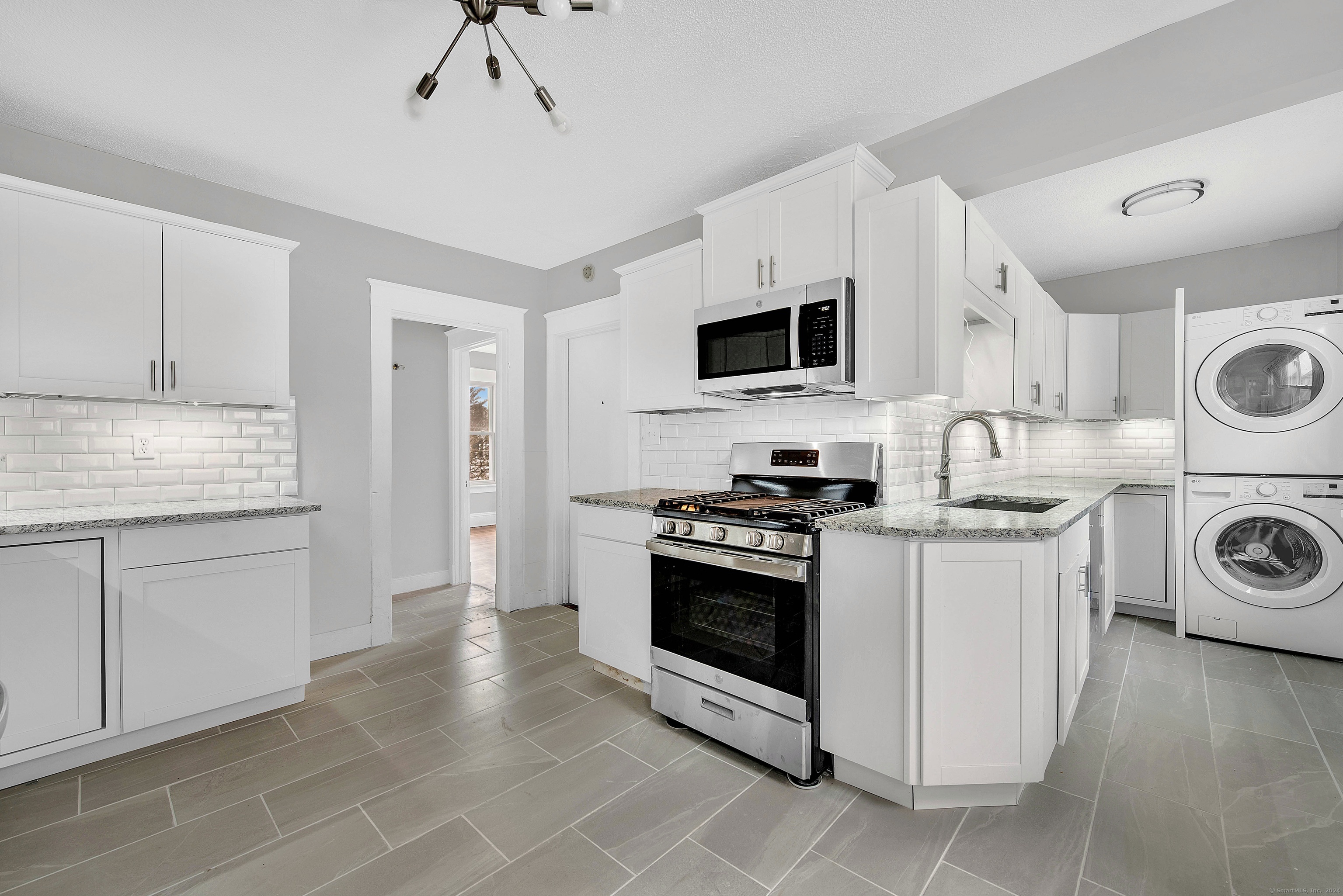 a kitchen with a stove and a microwave