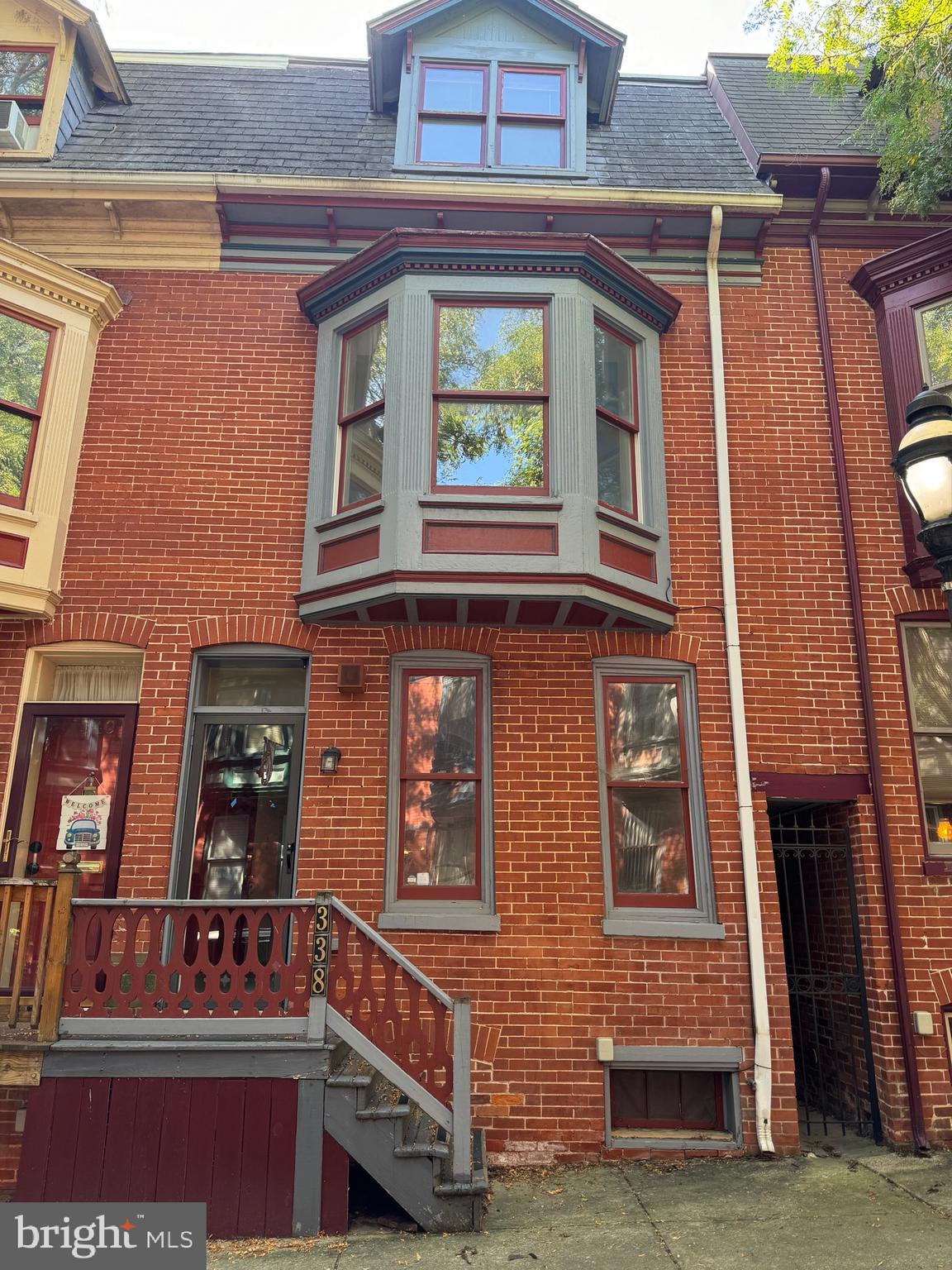 a view of front door of house with stairs