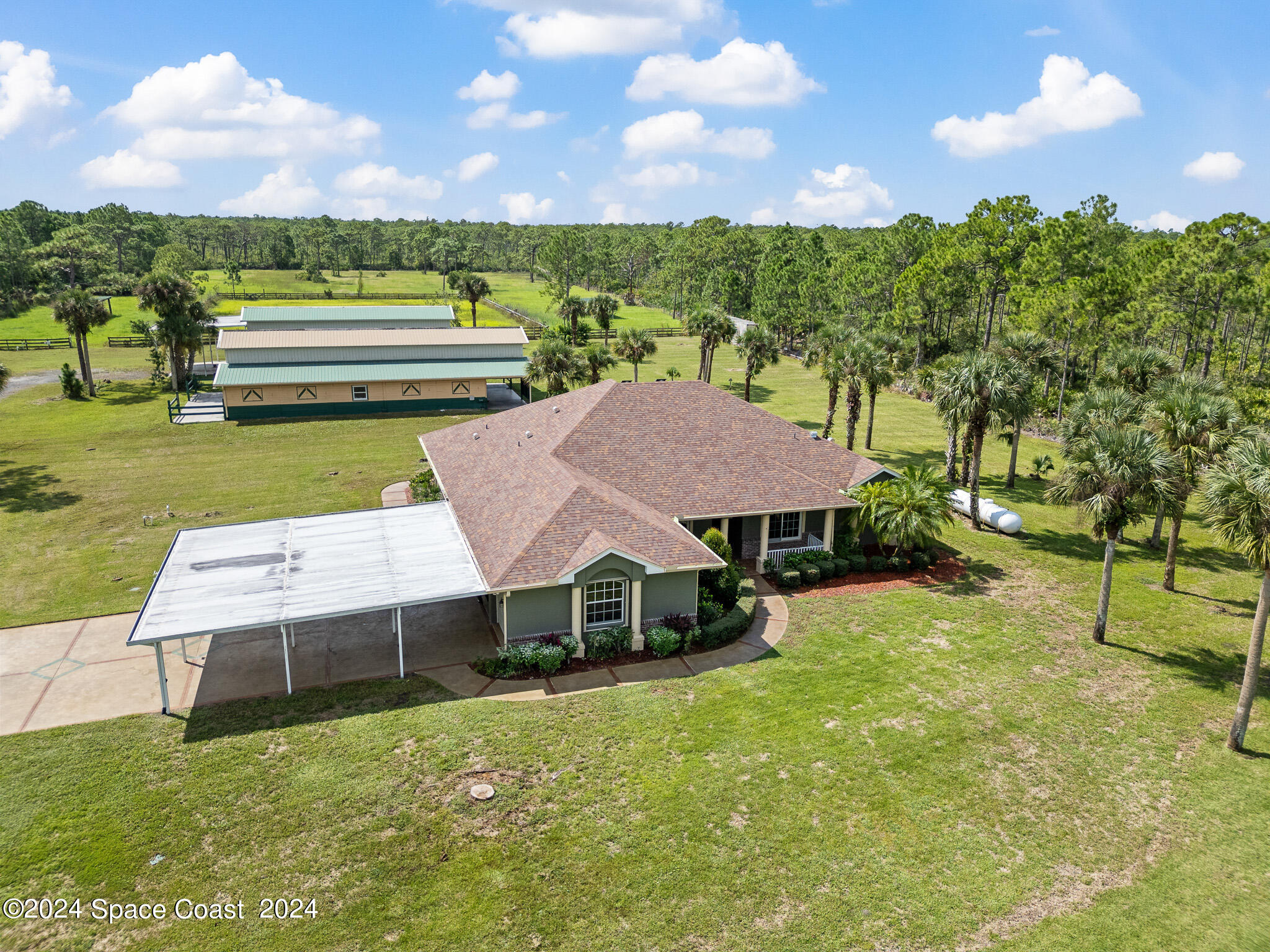 a view of a house with a big yard