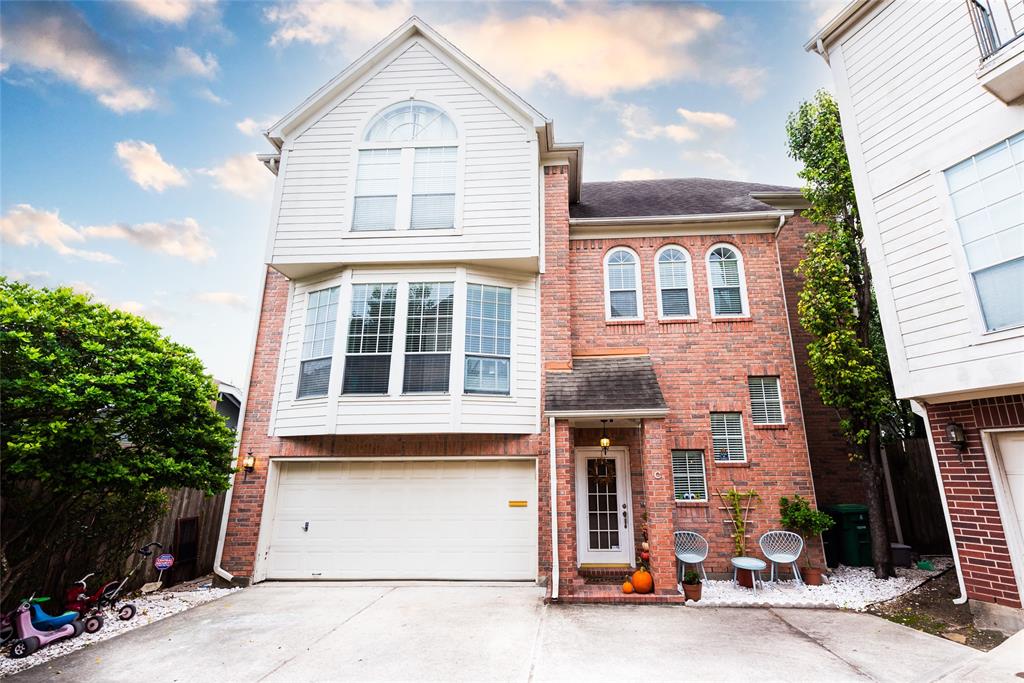 a front view of a house with a garage