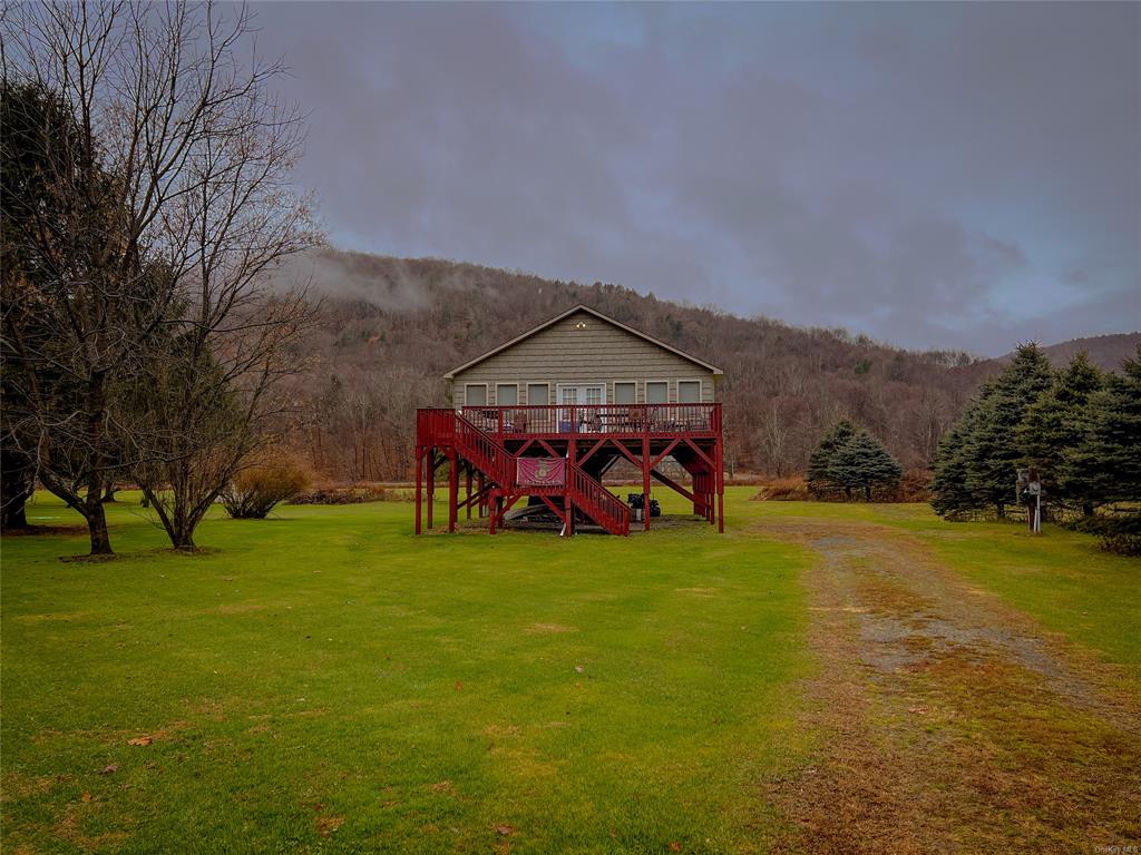 View of yard featuring a deck