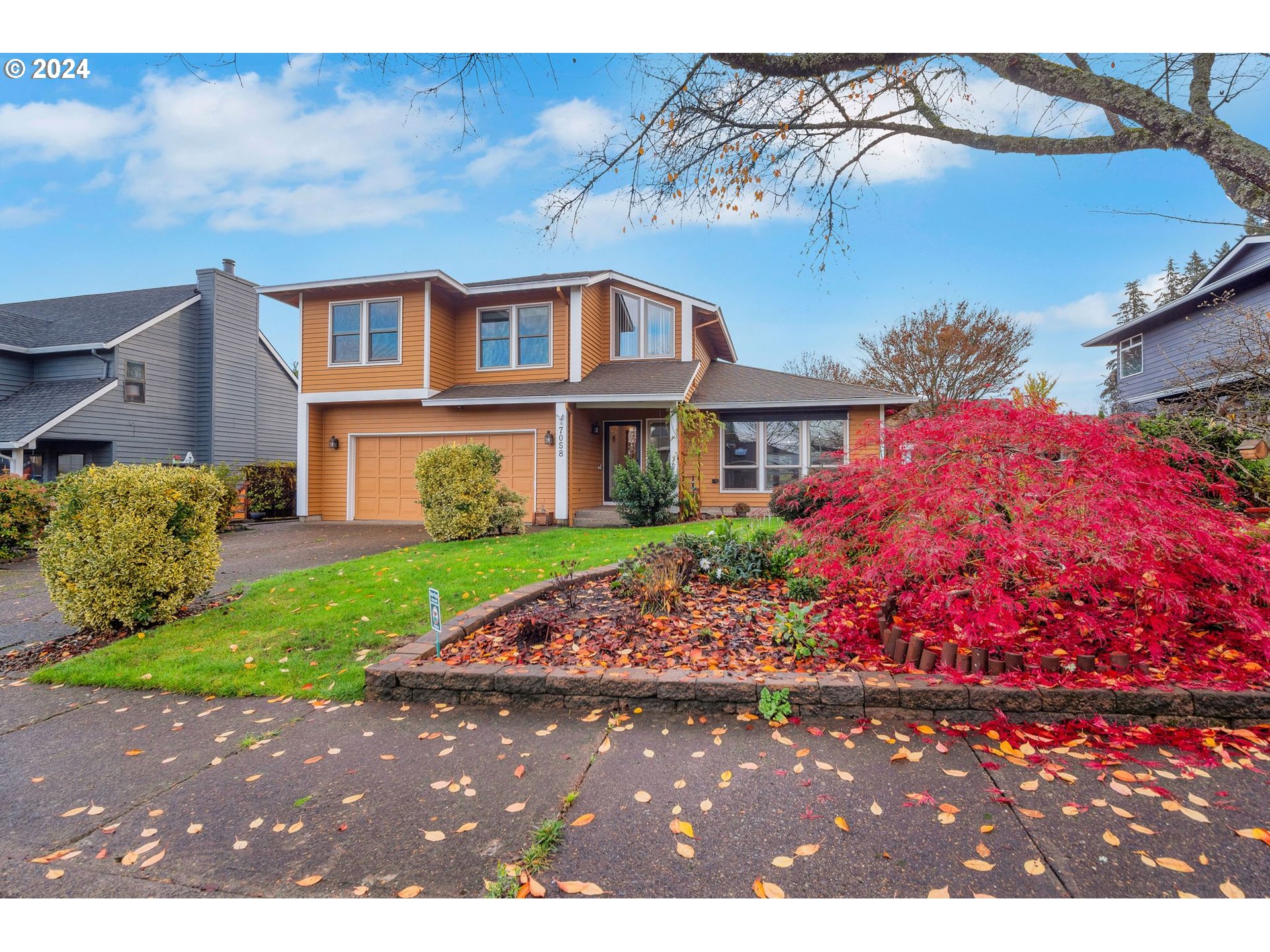 a front view of a house with garden