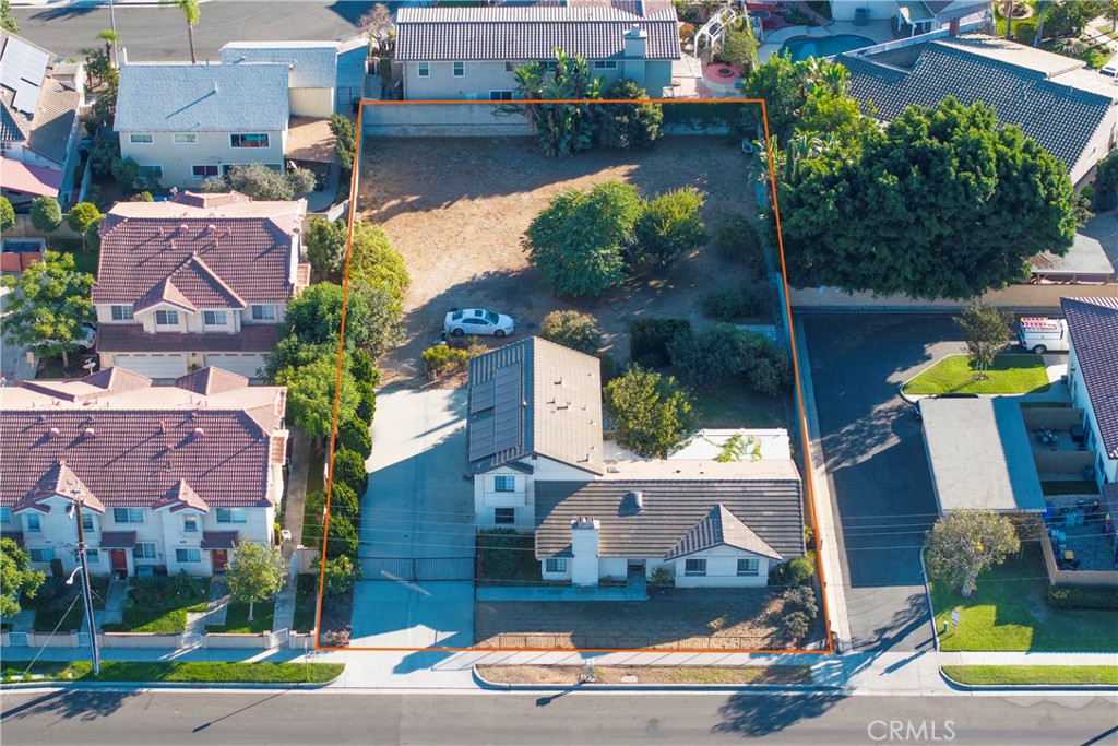 an aerial view of houses with yard