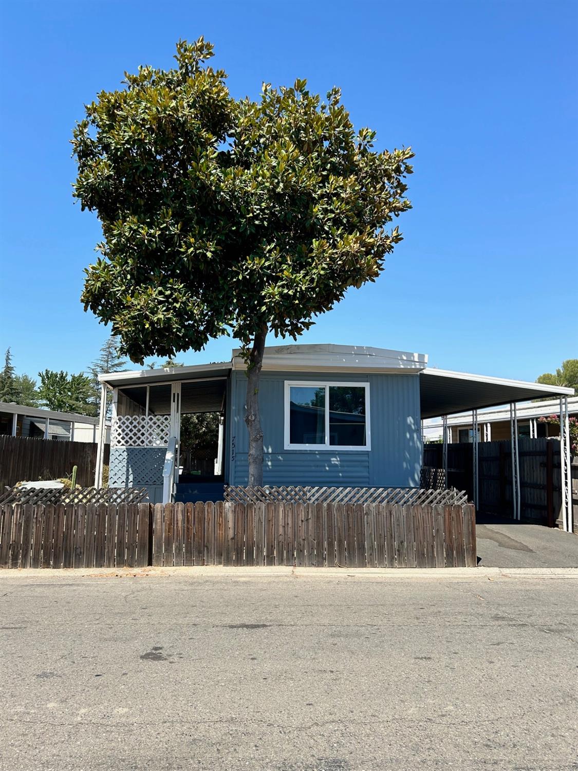 front view of a house with a small yard