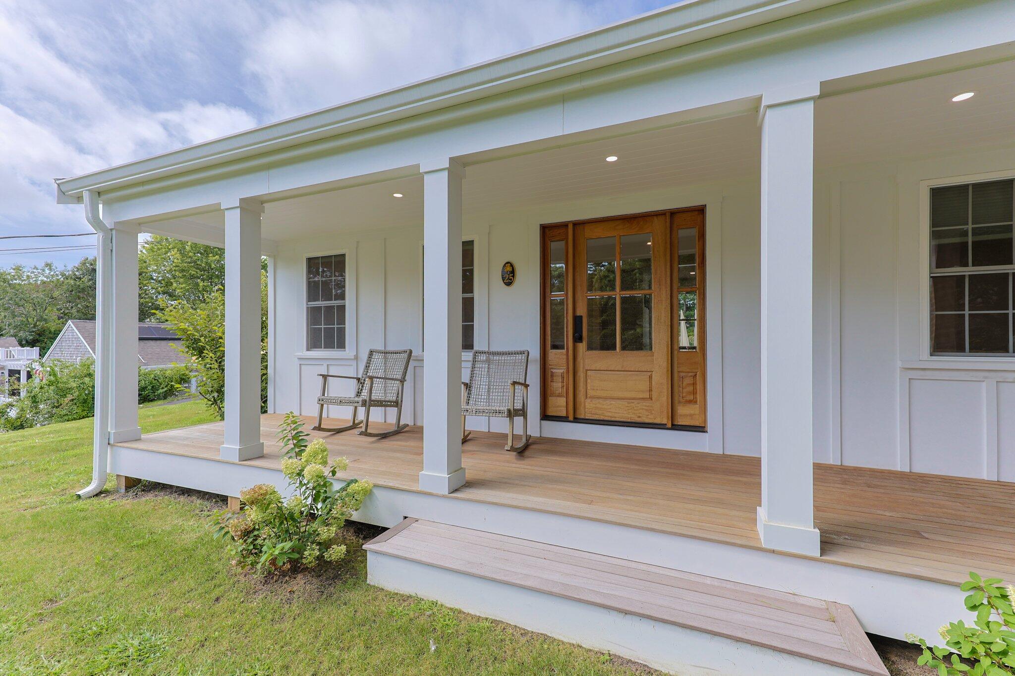 a front view of a house with a porch