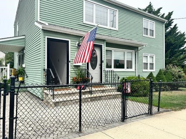 front view of a house with a small yard