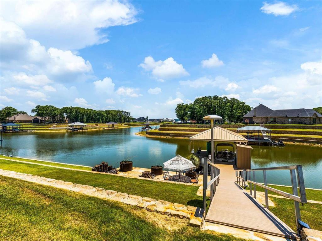 a view of a lake with a house in the background