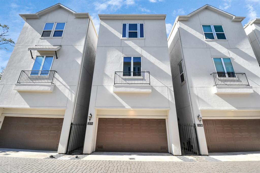 a front view of a house with garage