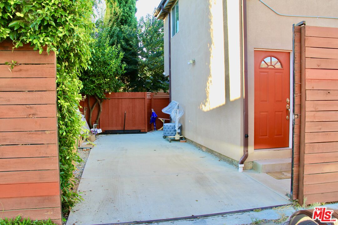 a backyard of a house with a tree