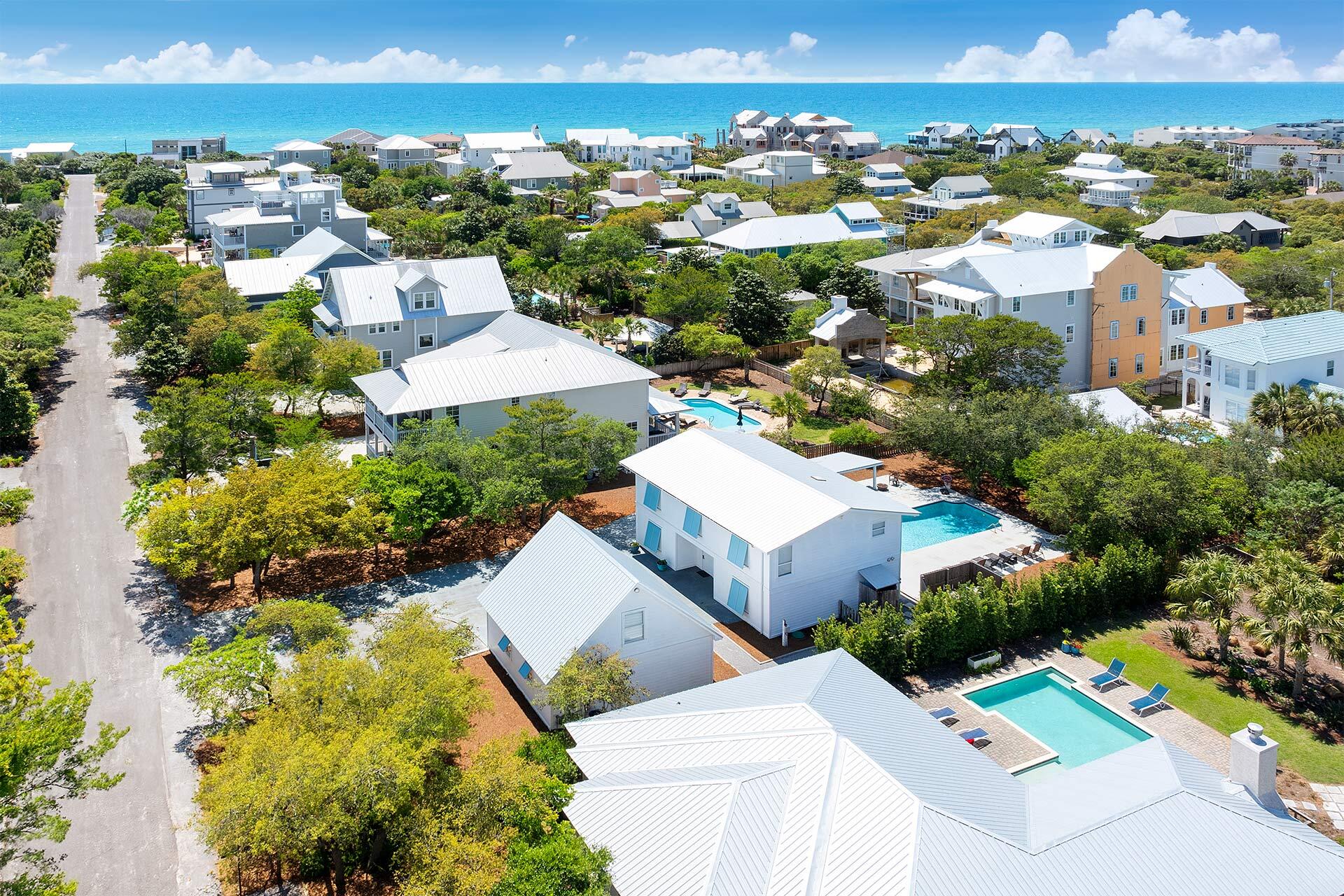 an aerial view of residential houses with outdoor space