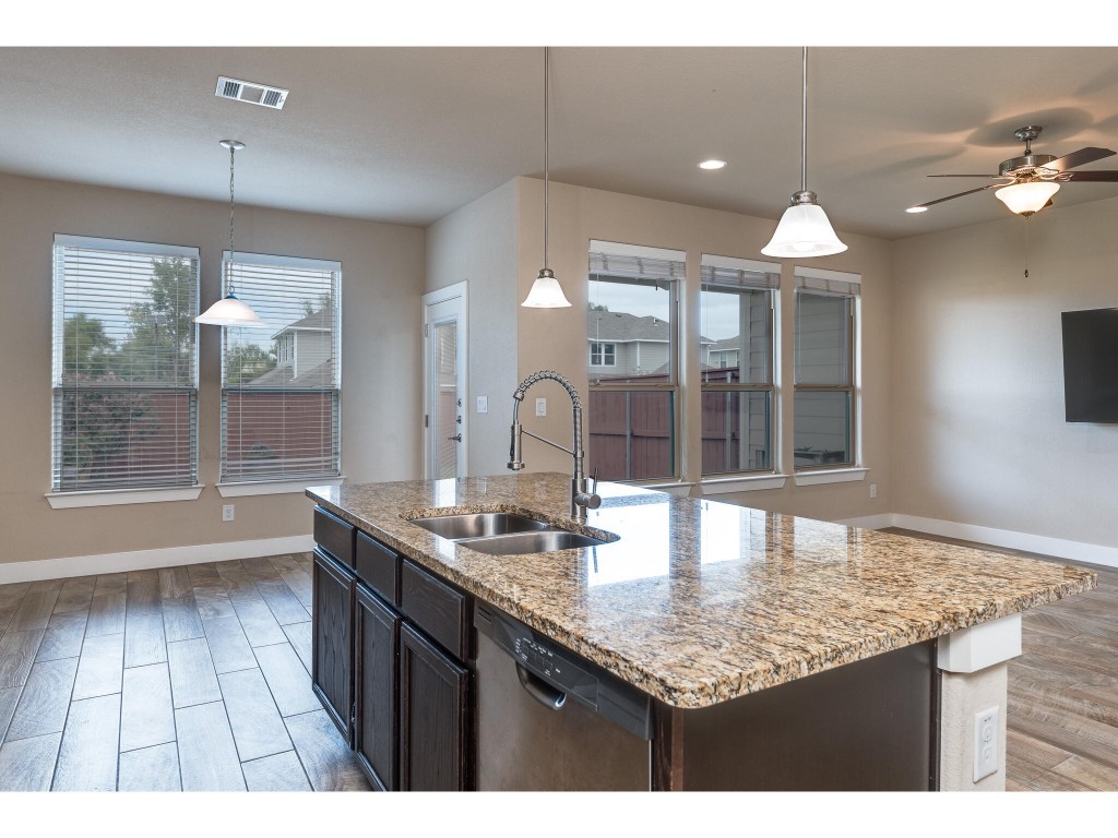 a kitchen with sink and window