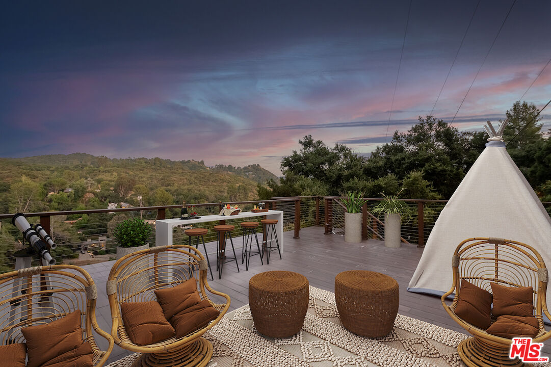 a view of a chairs and table in patio