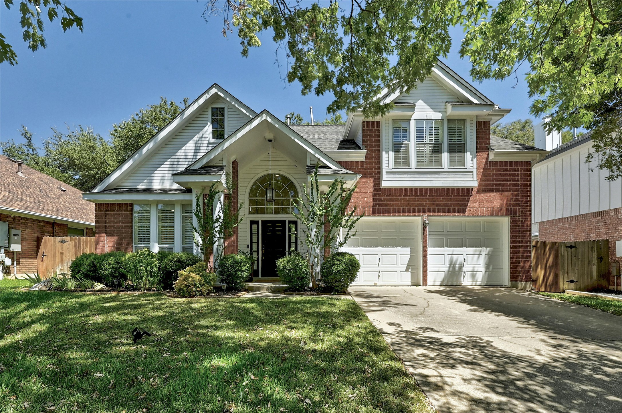 a front view of a house with a yard and porch