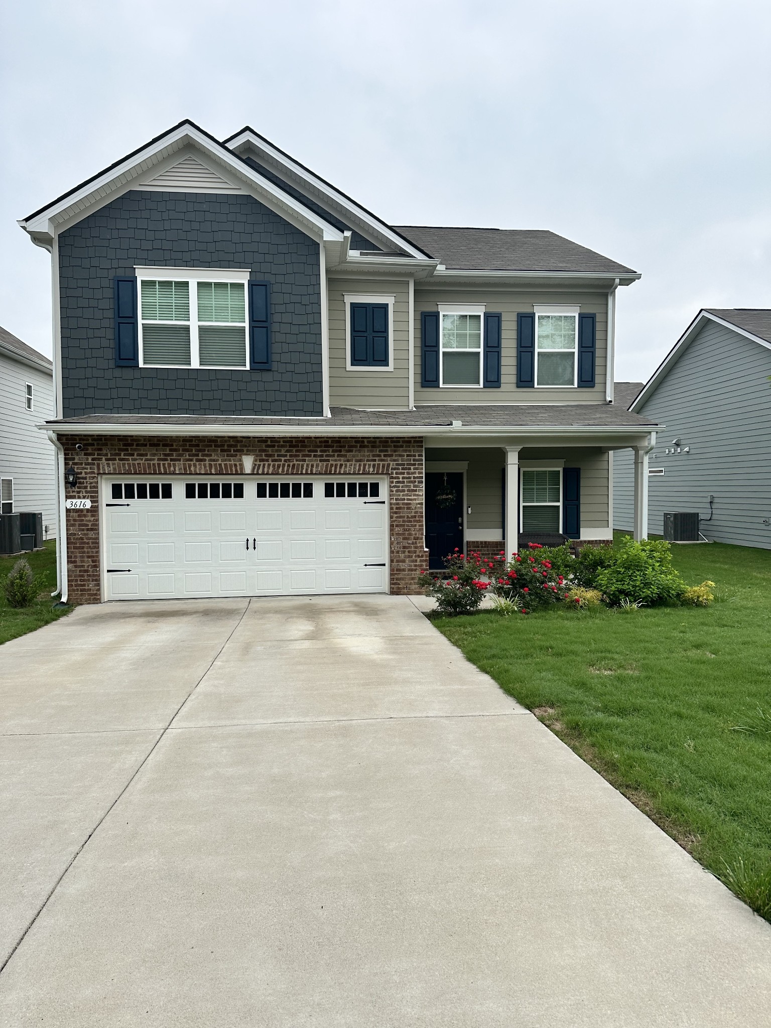 front view of a house with a yard