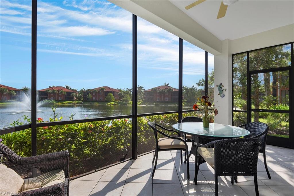 a view of a balcony dining table and chairs