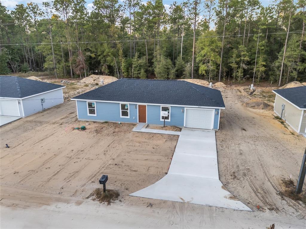 a aerial view of a house with a yard