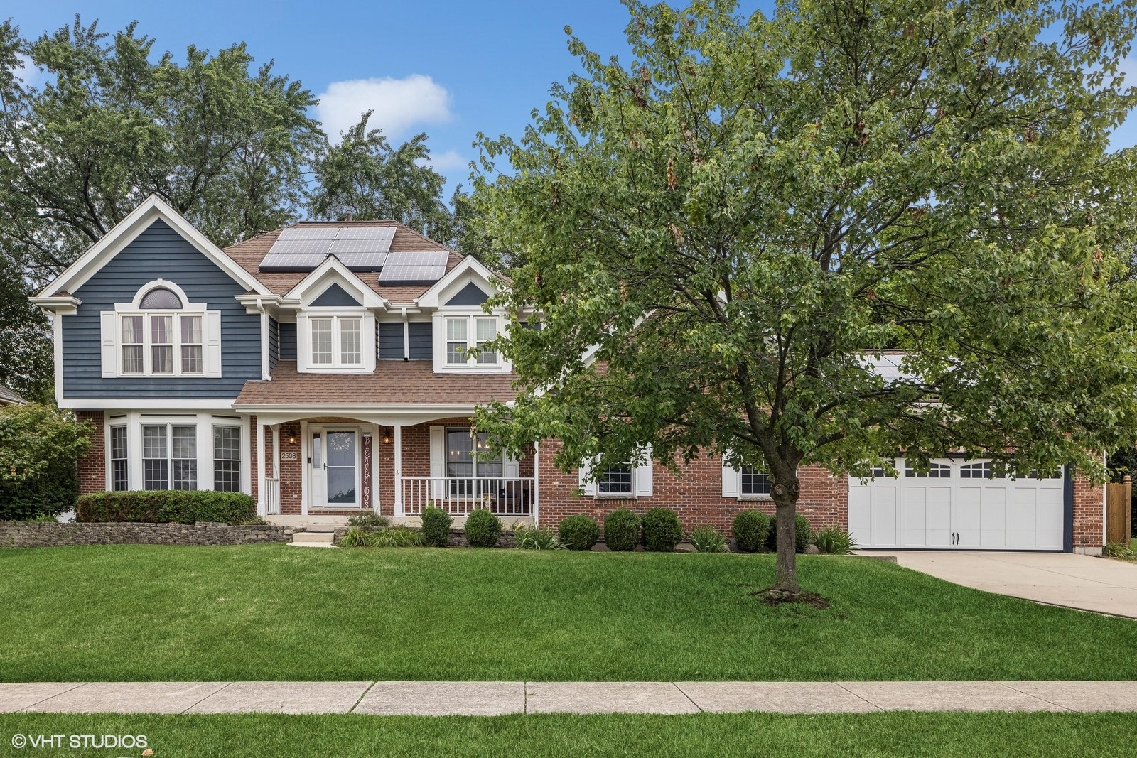 front view of a house with a yard