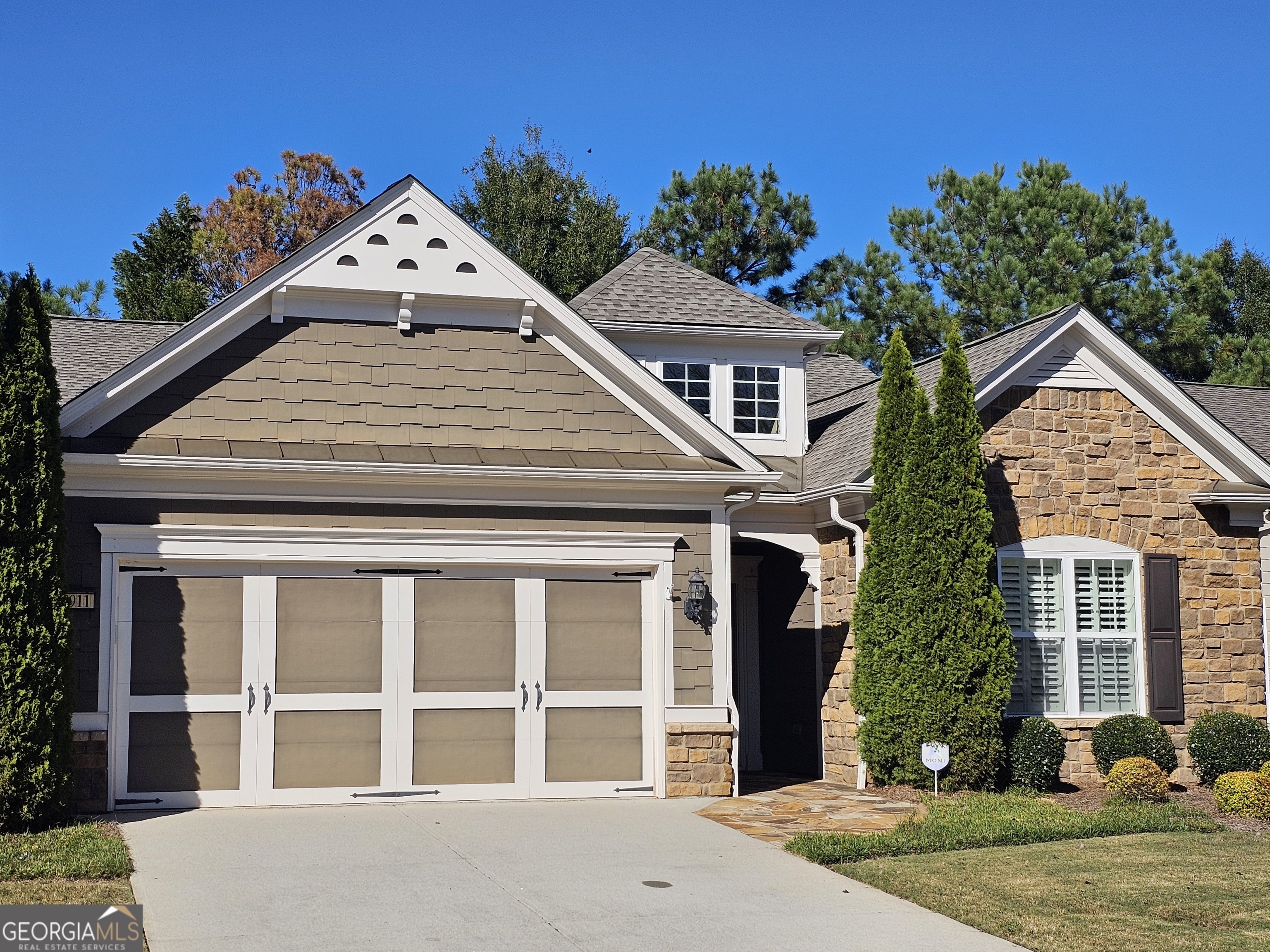 front view of a house with a yard