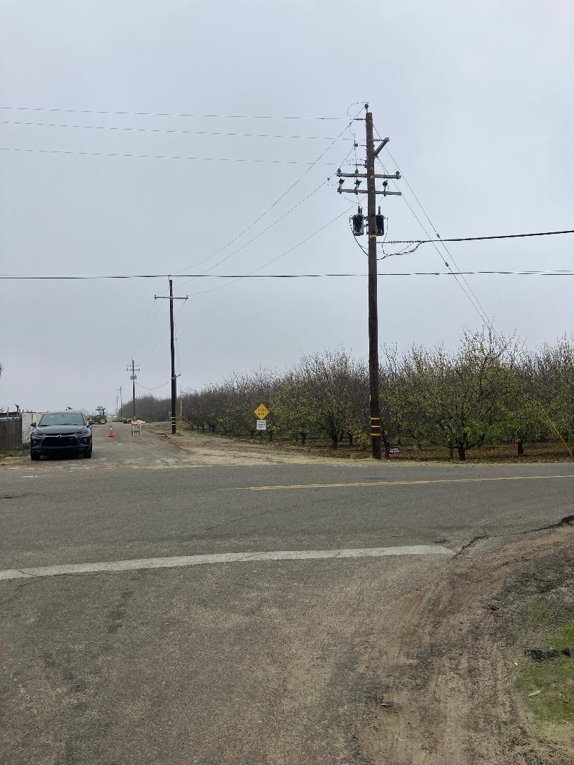 a view of a road with a building in the background