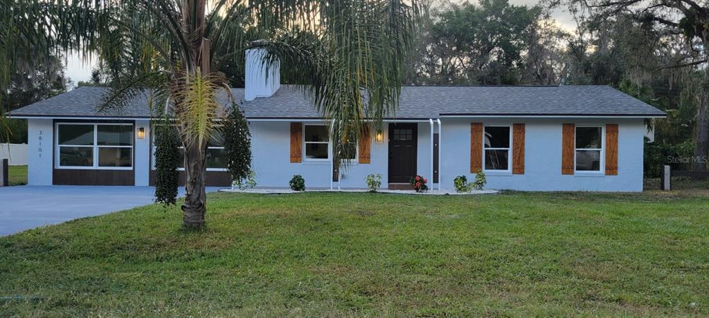 front view of a house with a yard