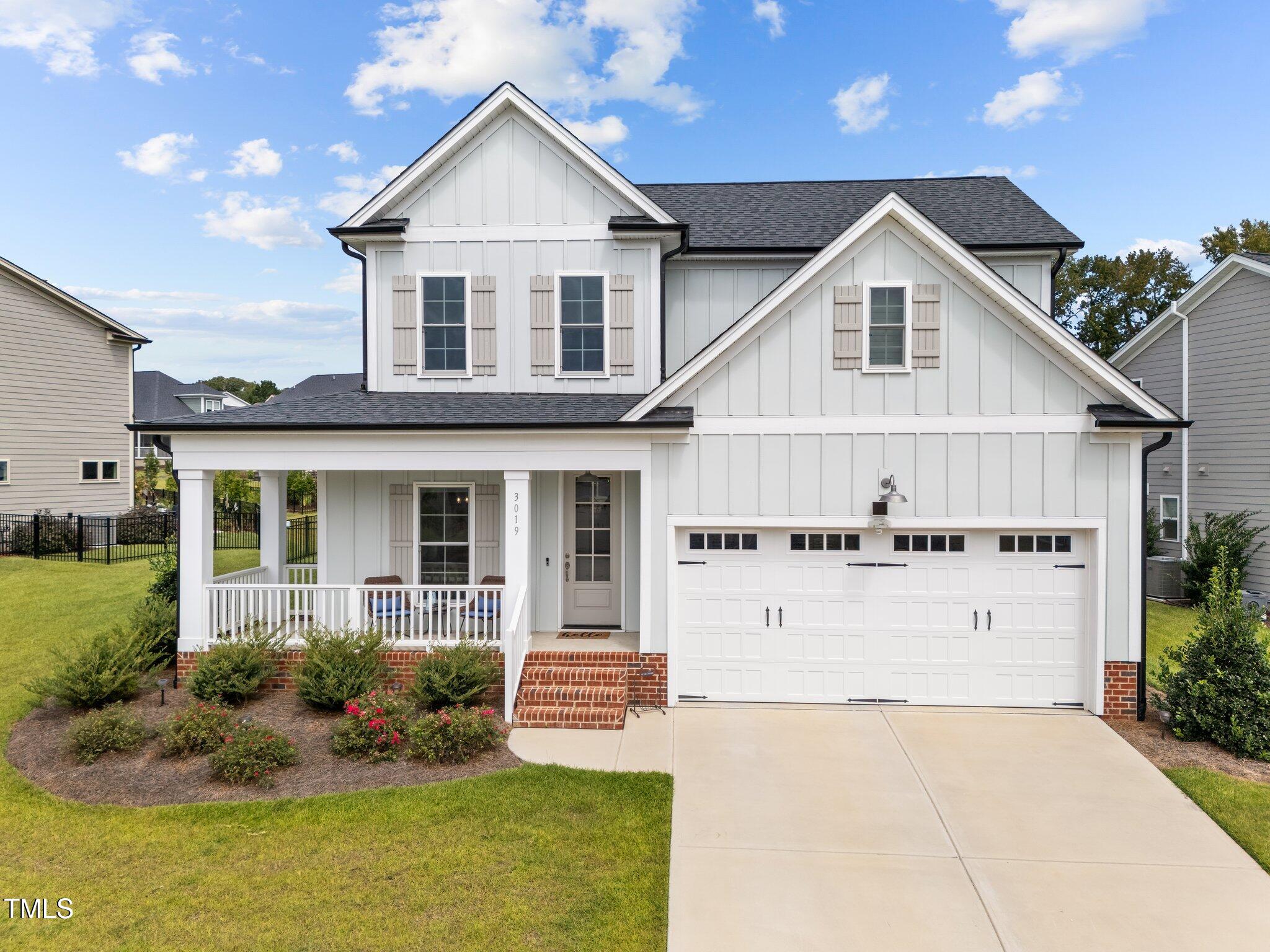 a view of house with yard and entertaining space