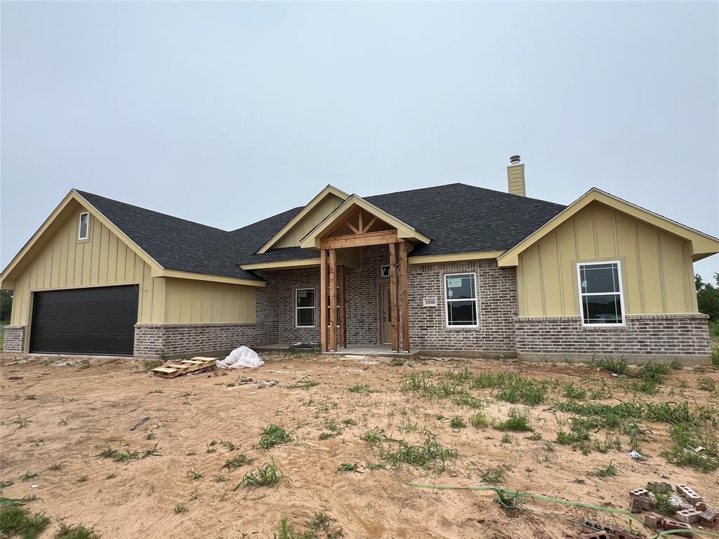 a view of house with yard and bathroom