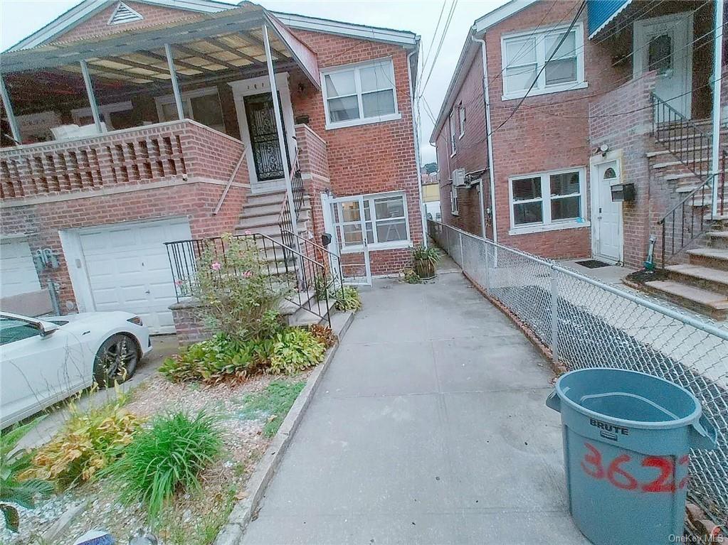 View of side of property featuring a garage