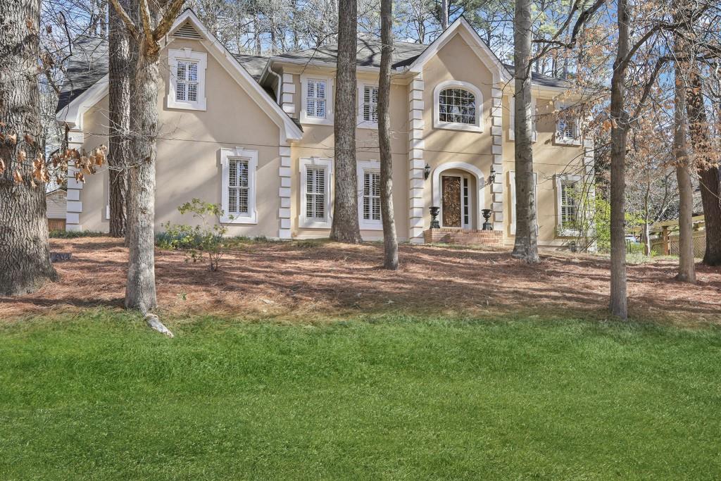 a front view of a house with a yard