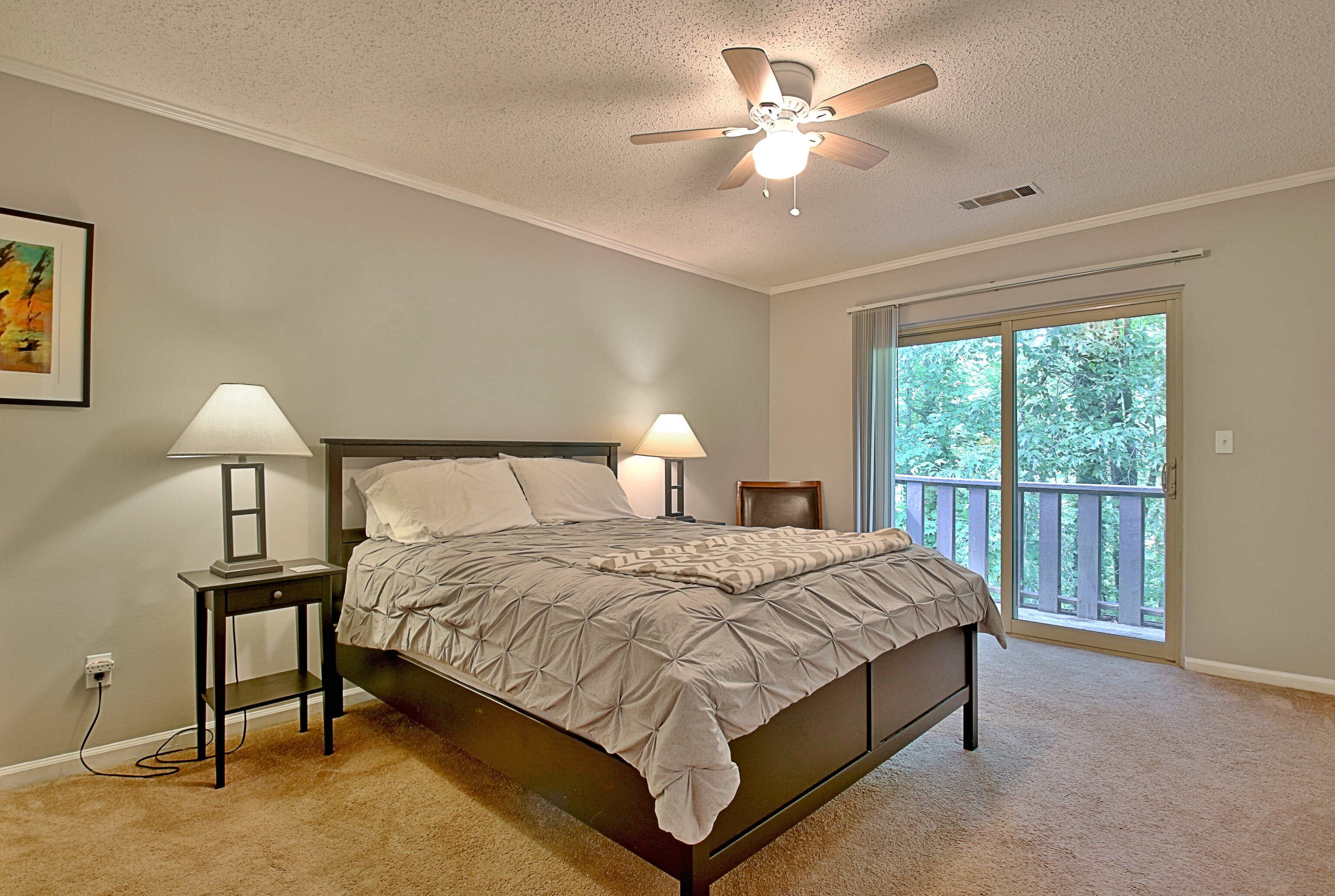 a bedroom with a bed and a lamp with window