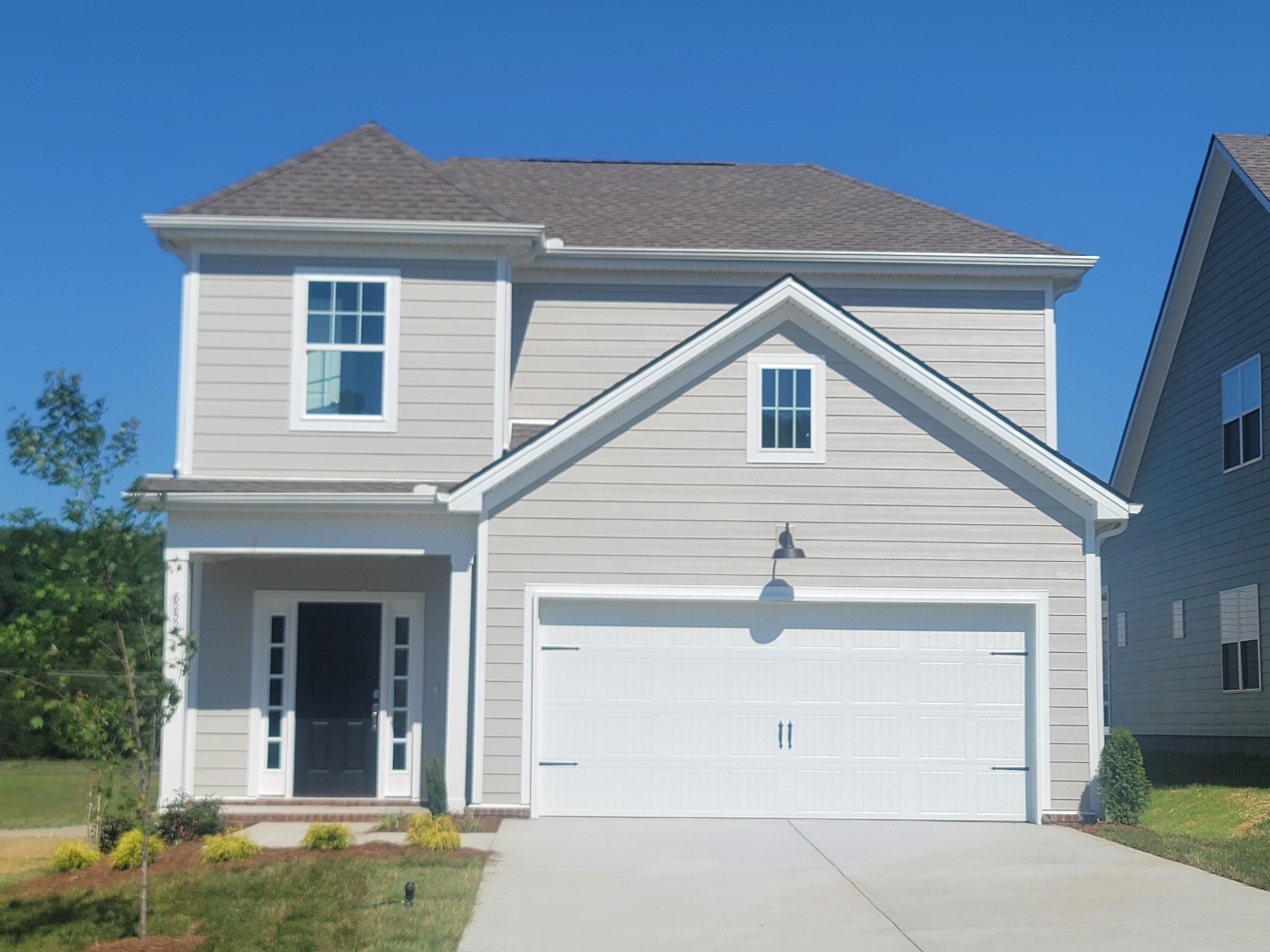 a view of house with yard