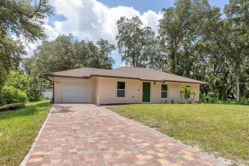 a front view of a house with yard