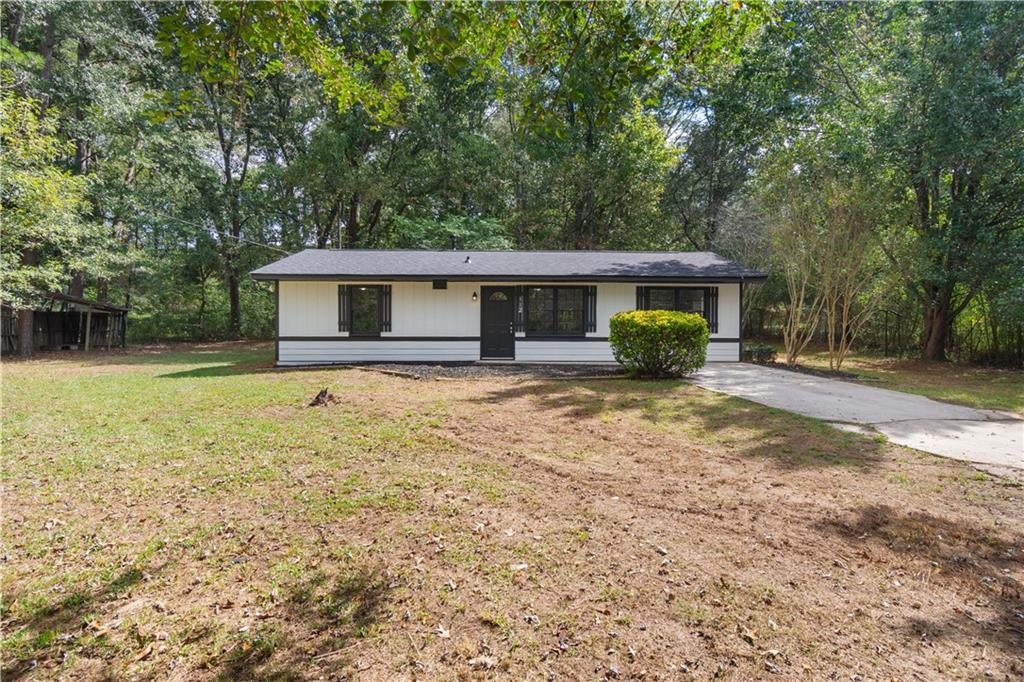 a front view of a house with yard