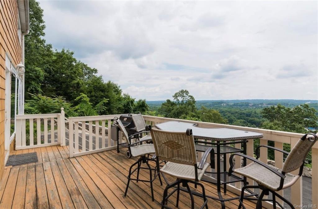 a view of a patio on wooden deck and floor