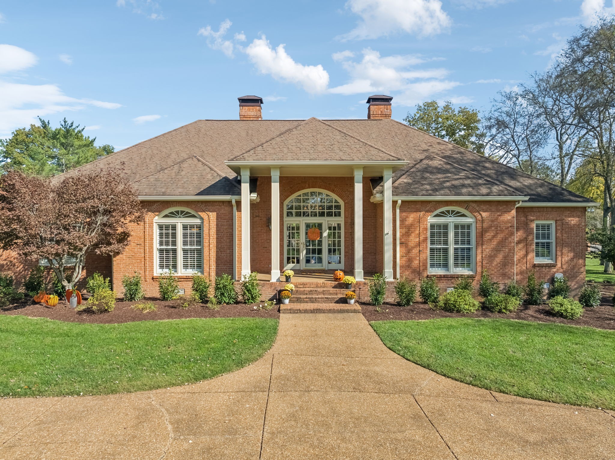 front view of a house with a yard