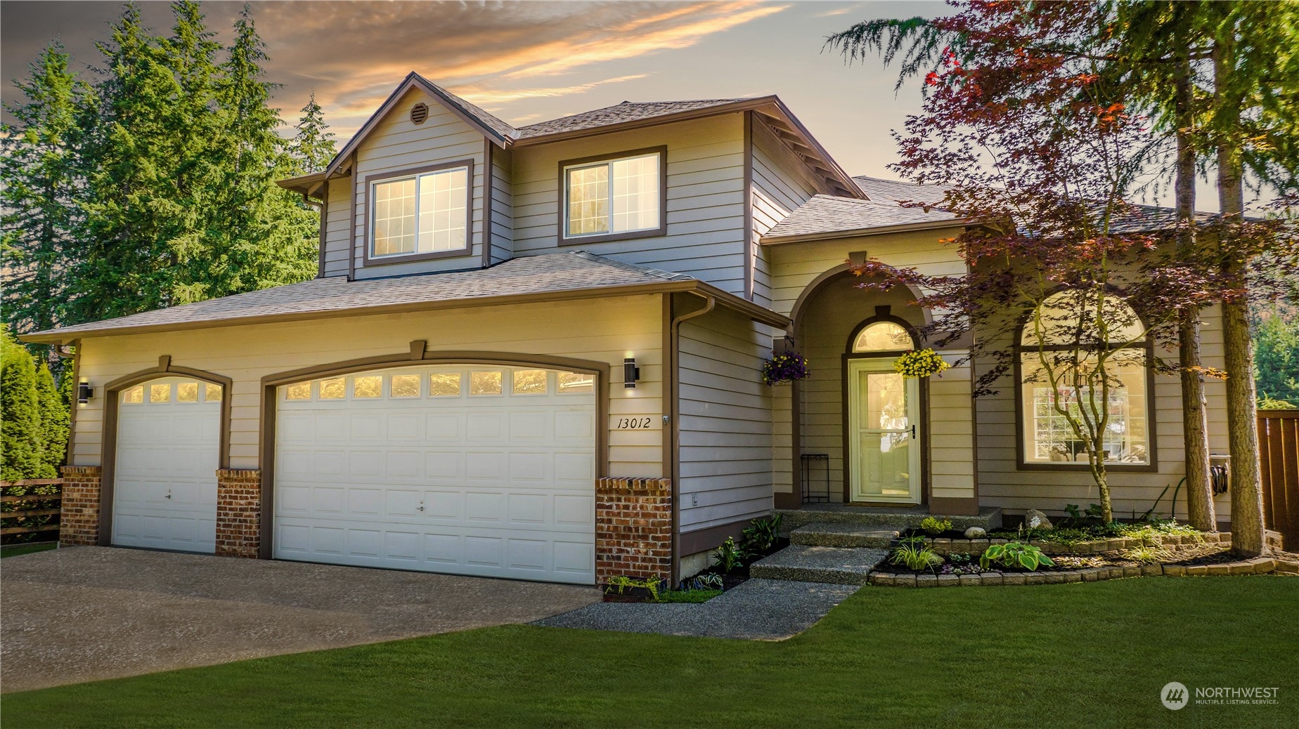 a front view of a house with a yard