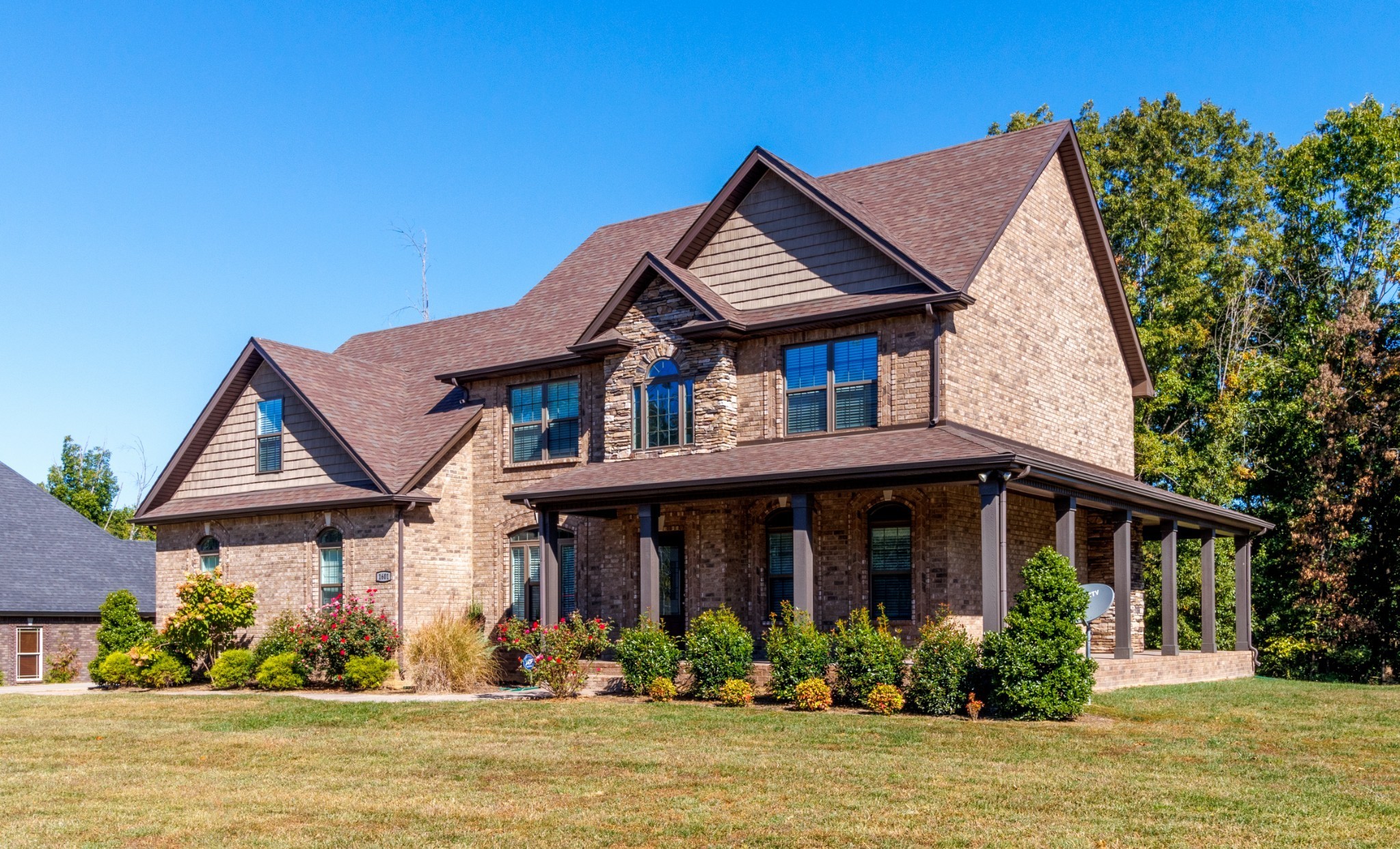 a front view of a house with a porch