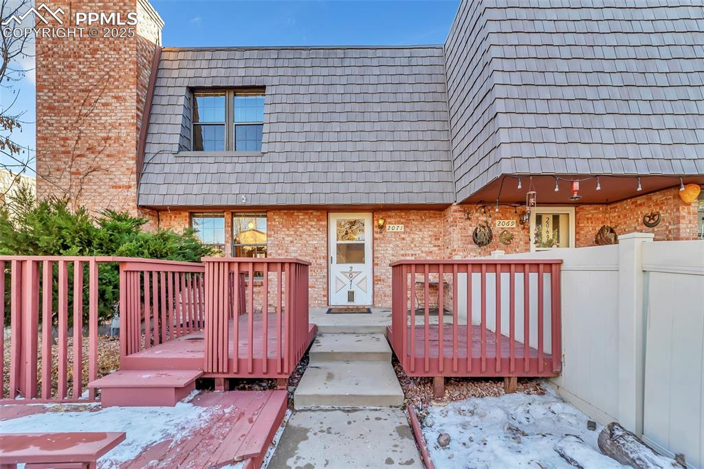 Charming Brick Exterior With Cedar Shake Accent