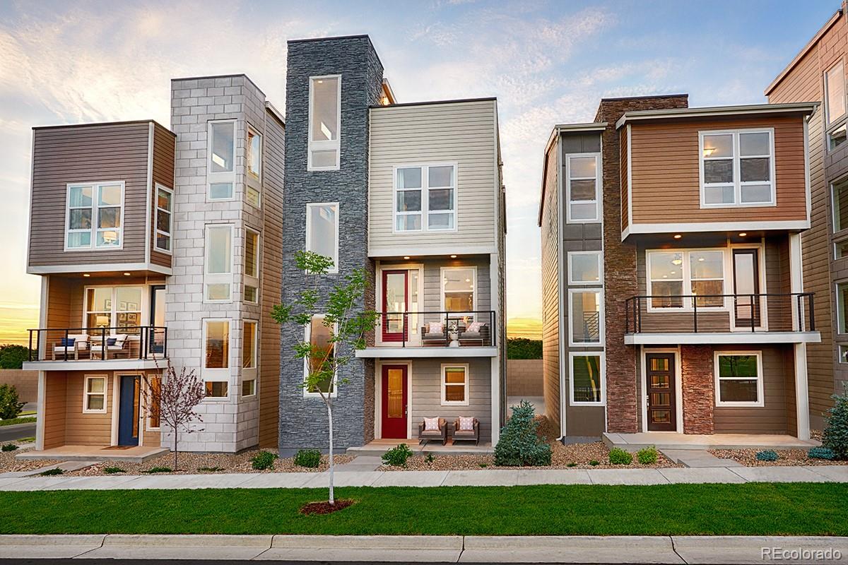 a front view of a residential apartment building with a yard