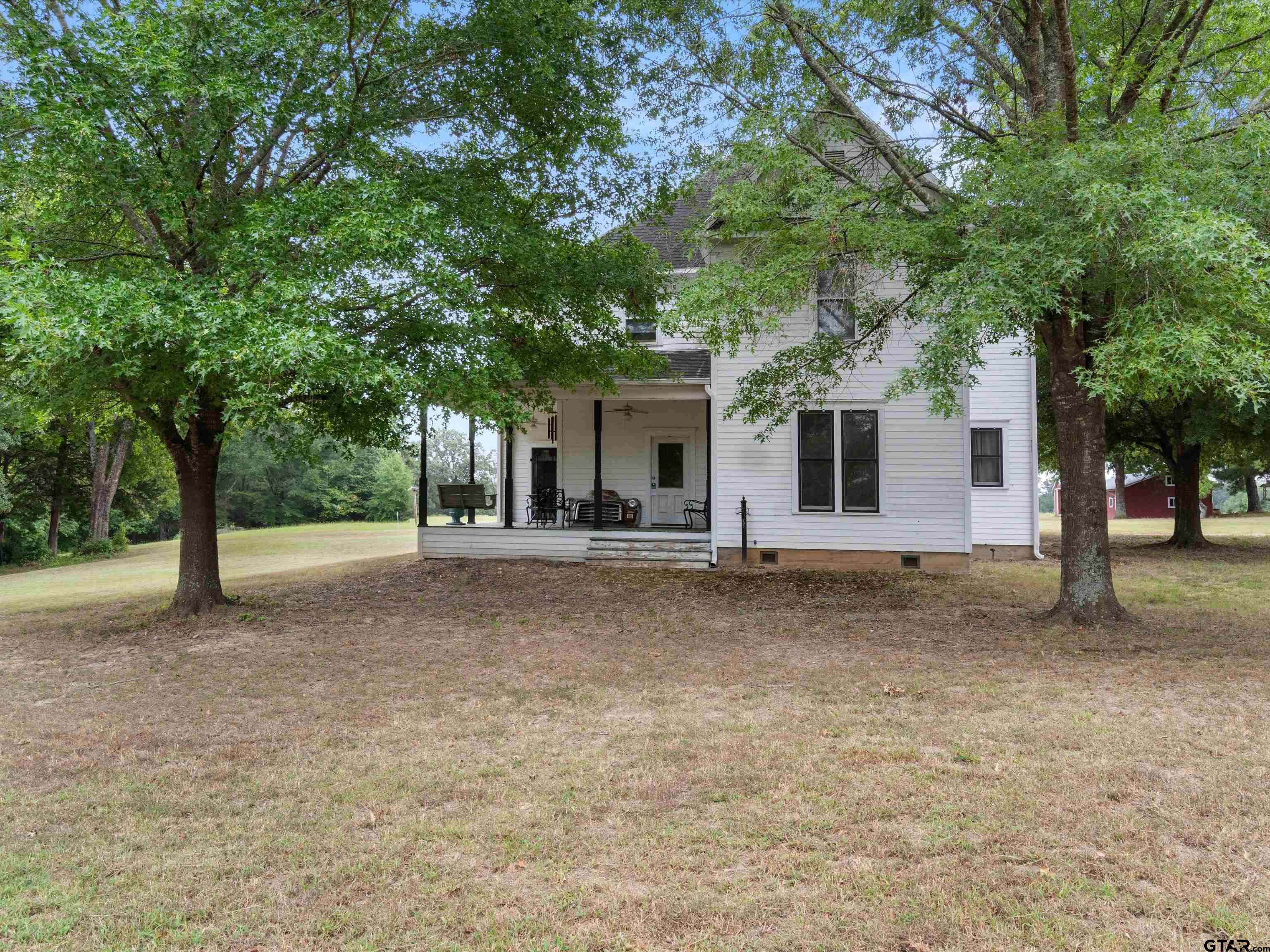 a view of a house with a tree